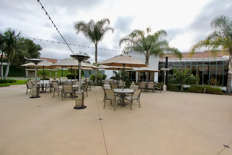 Sit by the palm trees on this patio in Oceanside, California