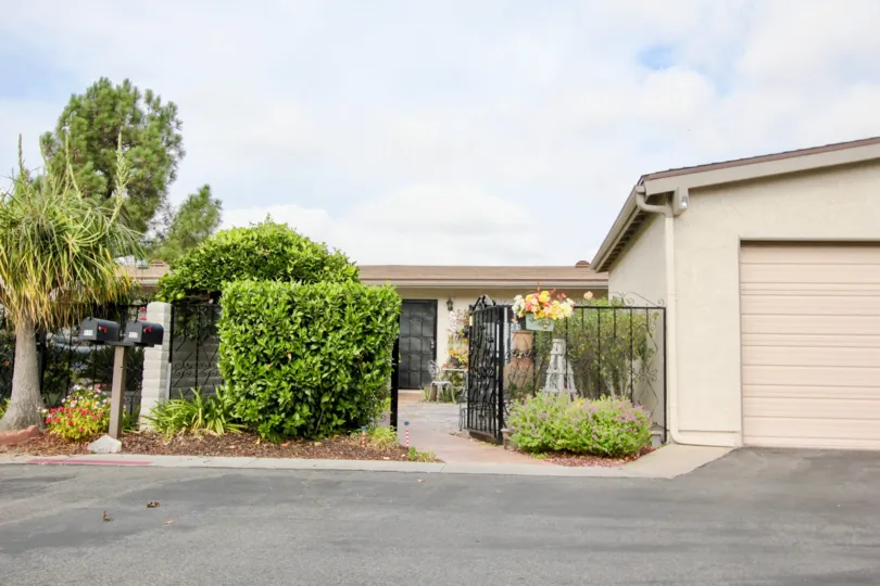 The iron gated courtyard welcomes you home at Oceana Mission.