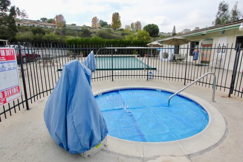 Beautiful clear blue pools with spa and patio tablets at Oceana Mission.