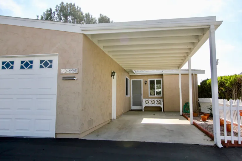 Entrance of a house with white bench Oceana South Oceanside California