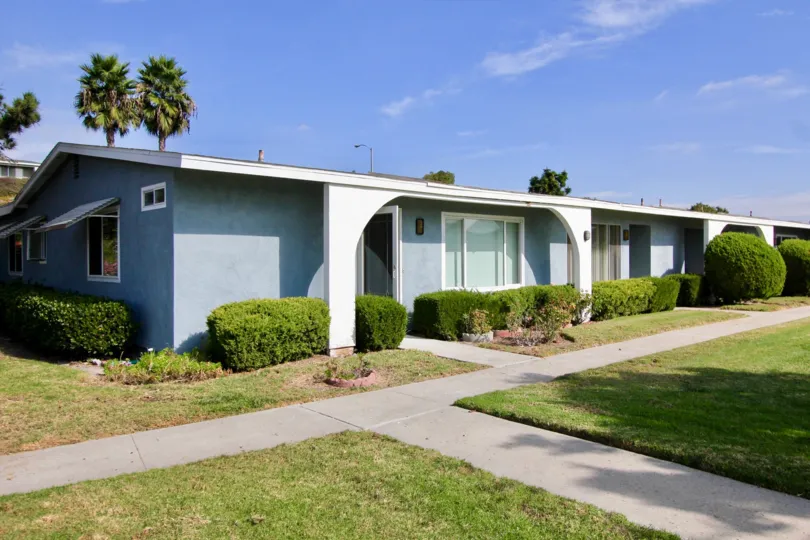 A blue single story condo home inside Oceana South at Oceanside CA