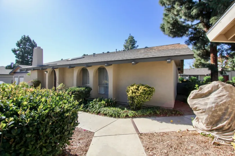 A one story house on a clear day located in Orchard Land in Oceanside CA