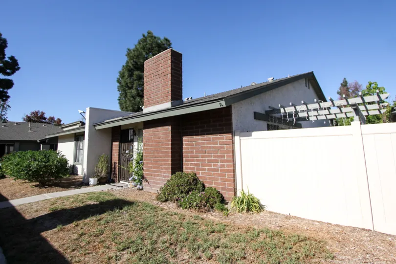 A rustic, partially brick building on a sunny day in Oceanside, California
