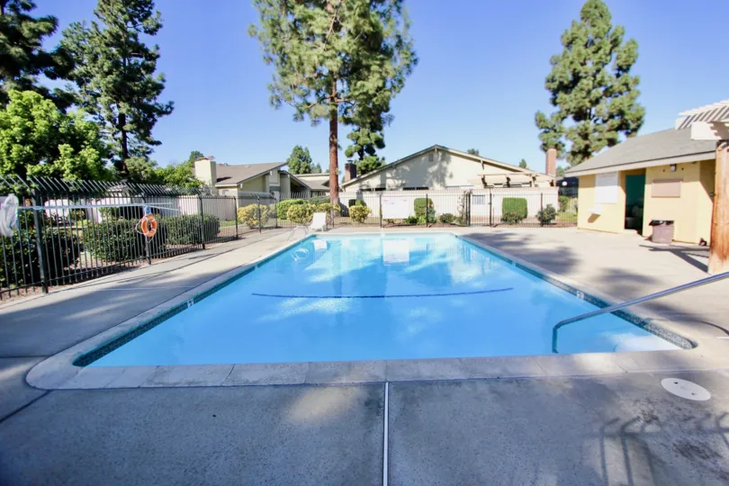 Large gated pool with surrounding houses, located in Orchard Lane, in the city of Oceanside, California.