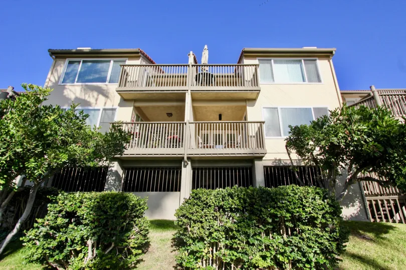 A grand shot of a several story property with porches and landscaping at Pacific Star Pine