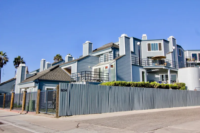 Blue color painted building have compound wall in Pacifica Strand
