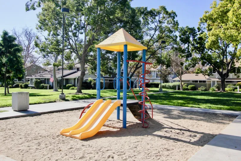 A play ground with colorful equipment and sand box at Park Circle