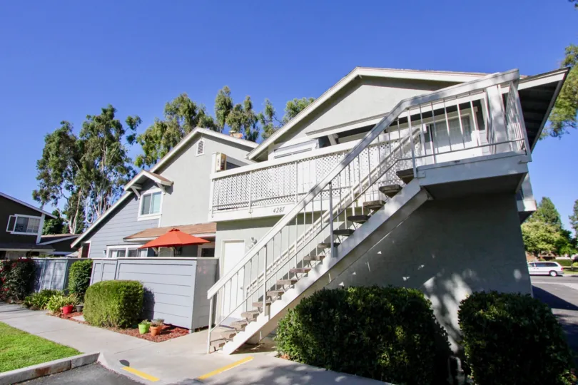 Stairway next to residence and above bushes inside Park Circles in Oceanside CA