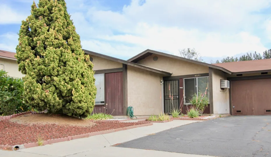 Single story home with black security door at Peacock Hills in Oceanside CA