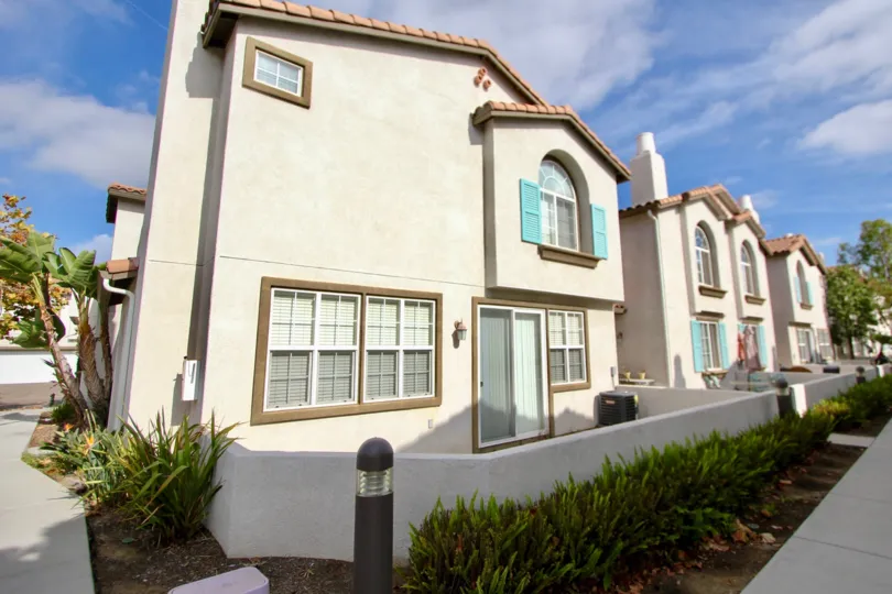 Visit with friends walking by as you sit on your patio at Pelican Cove.