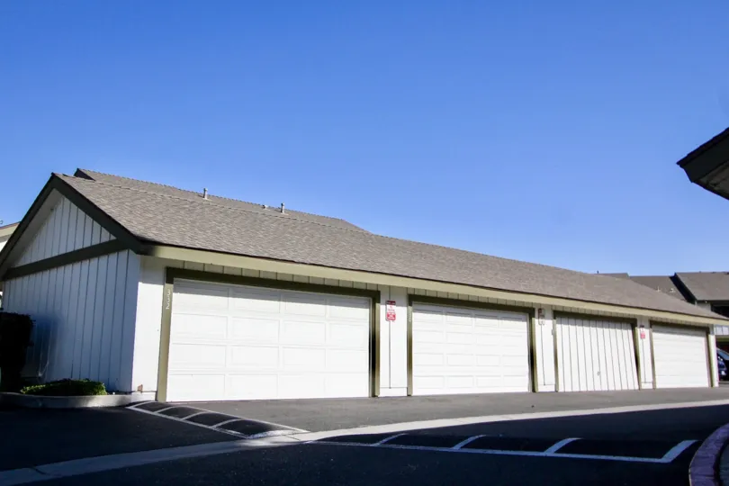 In the Pepperwood Villas community four garage doors are on a building.