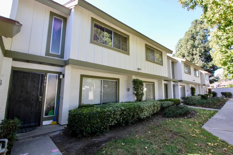 Two story town homes units with small lawns in Pepperwood Villas at Oceanside CA