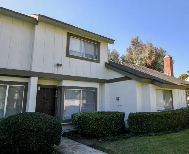 Brown front door at unit 330 in Pepperwood Villas, Oceanside, CA