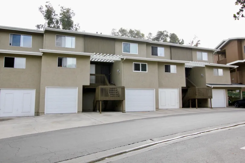 A sunny day in the area of Quail Ridge, outside, stairs, porch, garage, condo, street