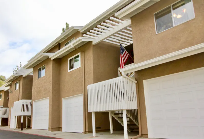 Private garages and balconies at Quail Ridge in Oceanside, California.