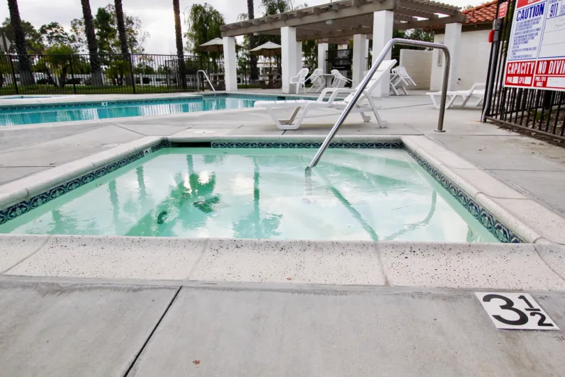 A swimming pool near a hot tu inside the Rancho Rose at Oceanside CA