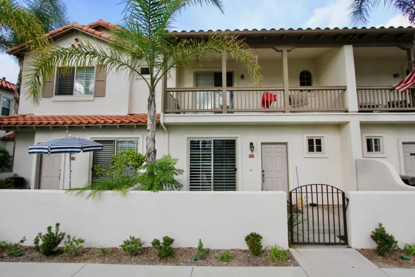 Rancho Rose Townhouse with red tile roofs and outdoor patio