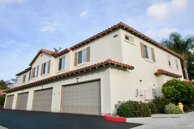 A view of a big house with a two car garage in the Rancho Rose community
