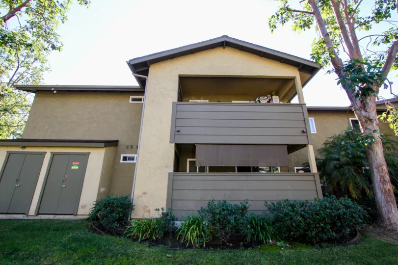 Two story town homes with brown patios inside River Trail at Oceanside CA