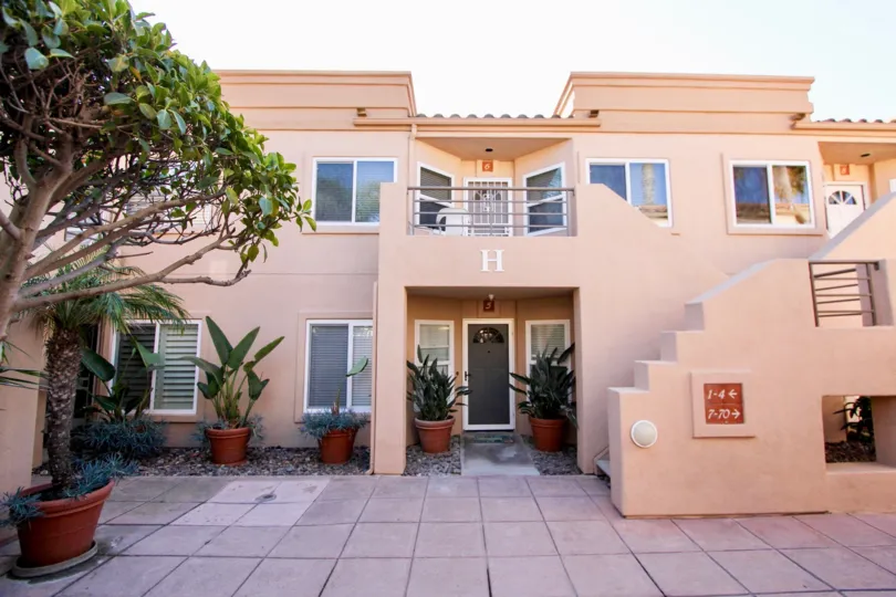 Pink color building with beautiful plantation outside of the home in San Miguel III.