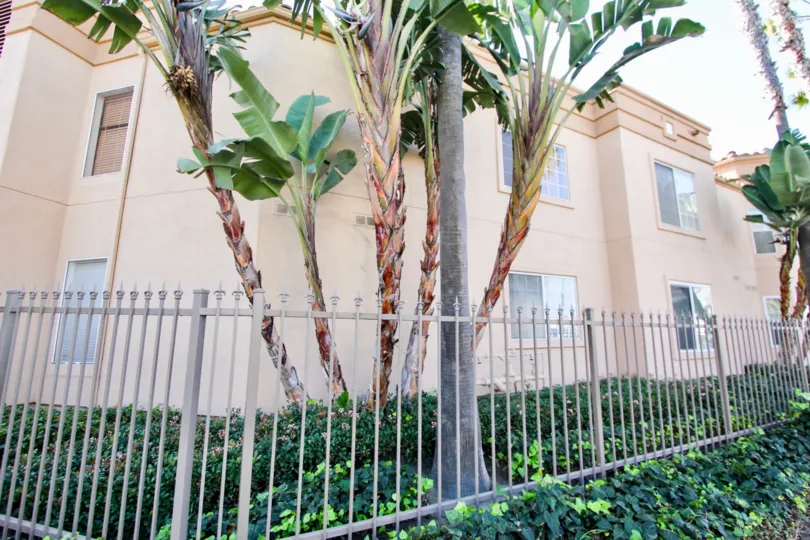 Gated gardens look very appealing in front of this beautiful buildingful