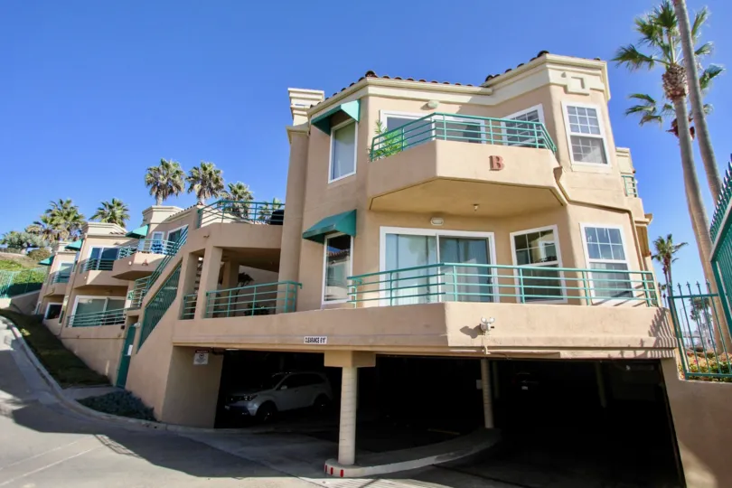 Two story residential units with large patios and parking underneath at San Miguel III in Oceanside CA
