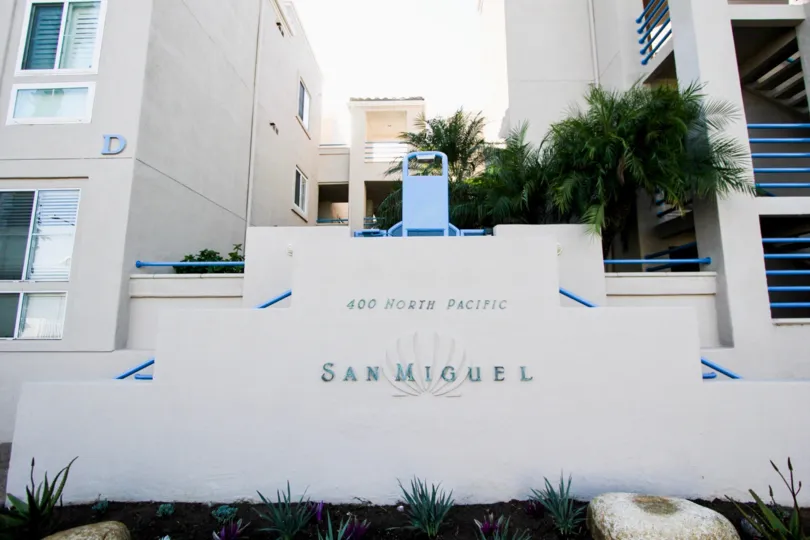 Entrance gate view of the building with board 400 NORTH PACIFIC in San Miguel IV