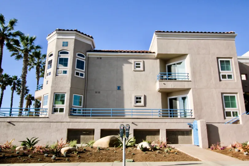 A low-rise residence in the San Miguel IV community painted in light brown color.