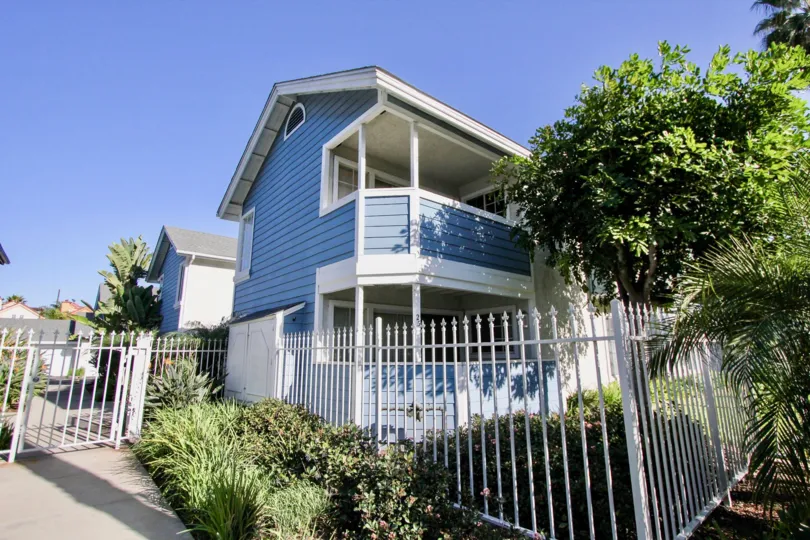 Blue horizontal panels cover the exterior of a condo at Sea Village