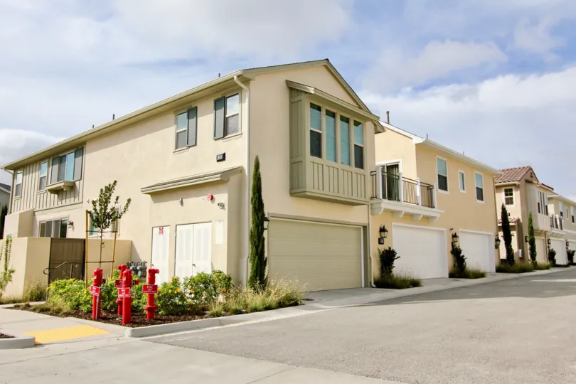 Street view of the building decorated with plants and trees in St Cloud at Ocean Ranch