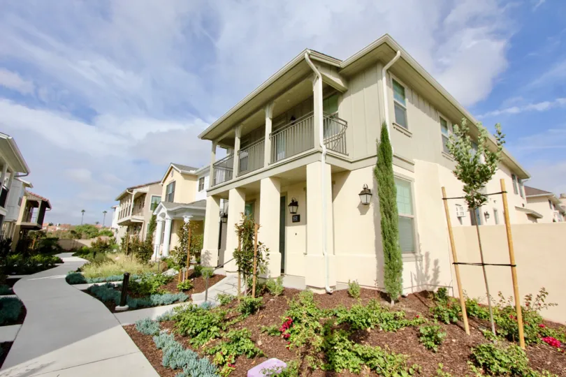 A sunny day in the area of St Cloud at Ocean Ranch, tree, balcony, sidewalk, condos