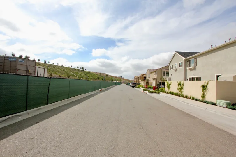 Dwellings in partially private area in a warm sunny climate. Clean streets and quiet neighborhood.