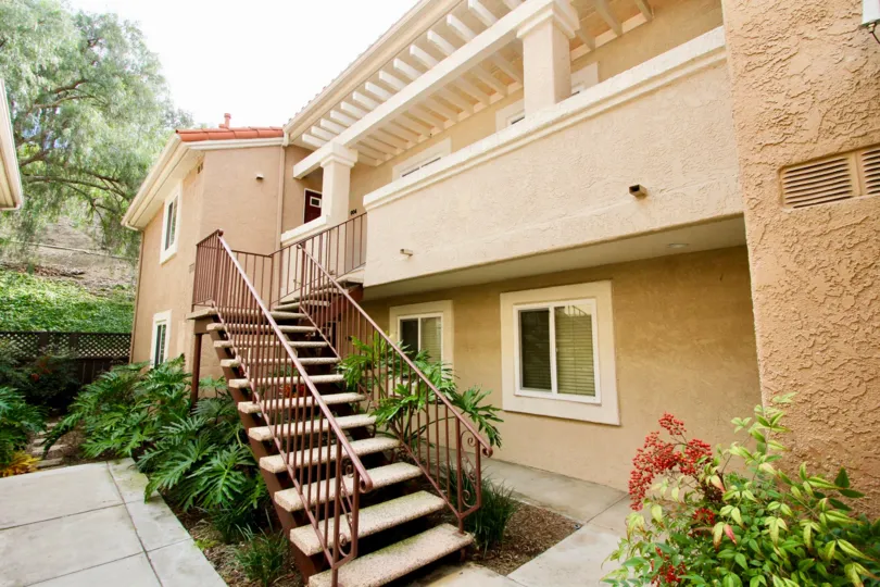 White and beige two story apartments located in The Bluffs community.