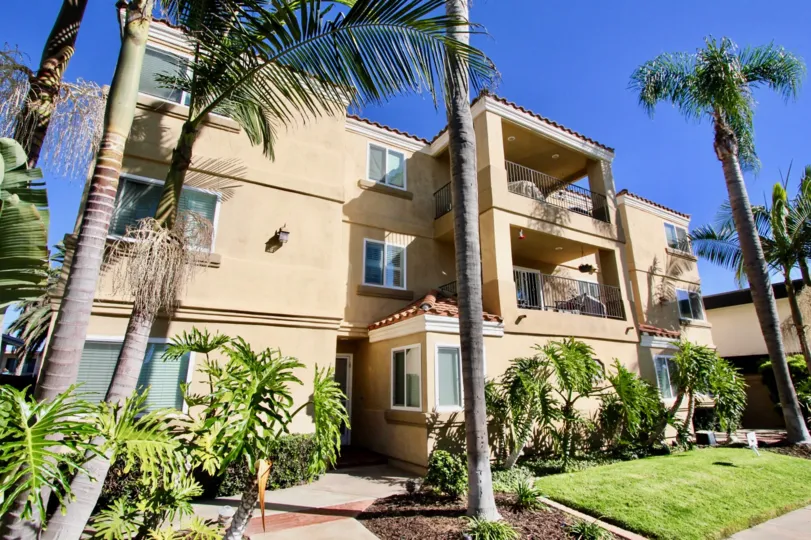 Back side view of a huge building with nice balconies in both floors in Tuscan Village Condos.