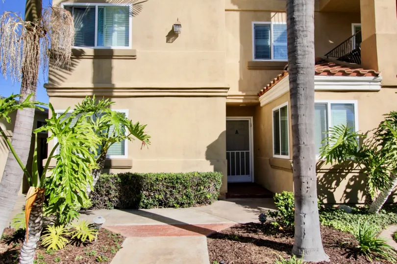 A view of condo A is shown in front of the Tuscan Village Condos in Oceanside, CA.