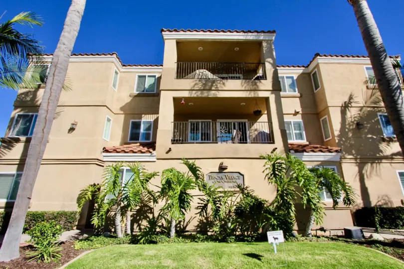 Tall palms and large balconies can be found in Tuscan Village Condos.