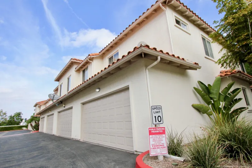 Private parking lot and tucked under garages at Villas at Mission Point in Oceanside, California.