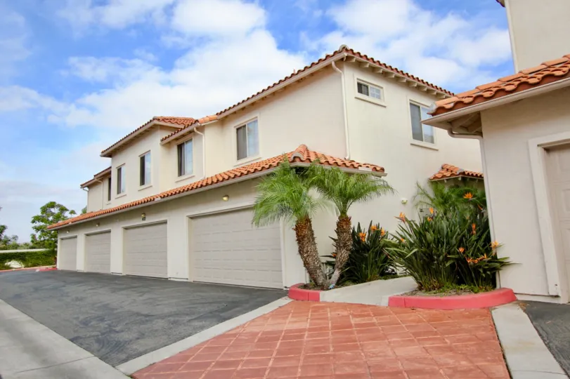 Red color roof tiles and palm trees with nice look in Villas at Mission Point.