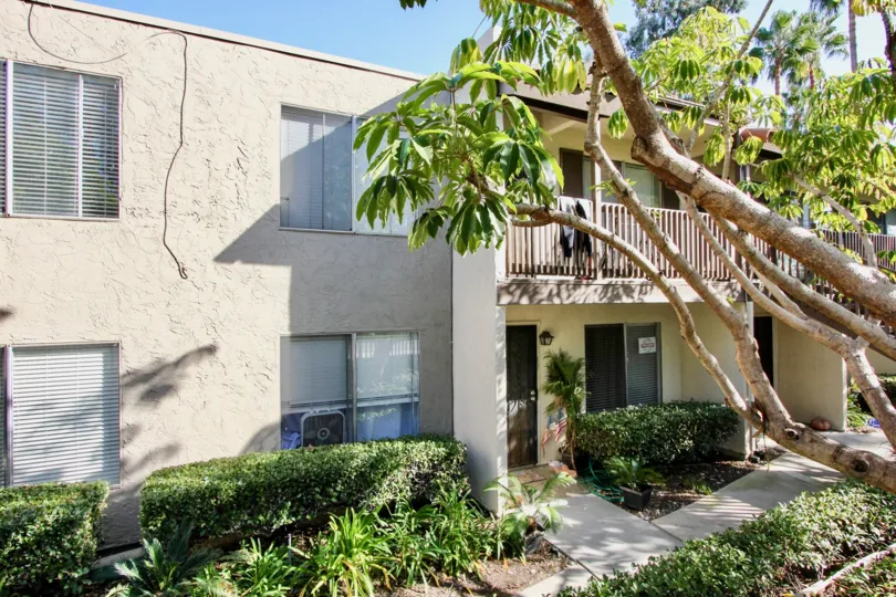 front view for the building with trees and plants in Vine Villas