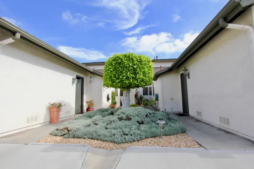 a well maintained garden with japanese tradition sort of look and housing around it located in Vista de Oceana of oceanside