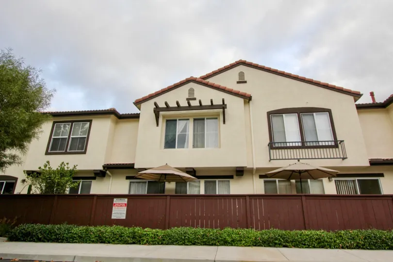 Light yellow, two-story condos in the community of Vista Monte, Oceanside, California.