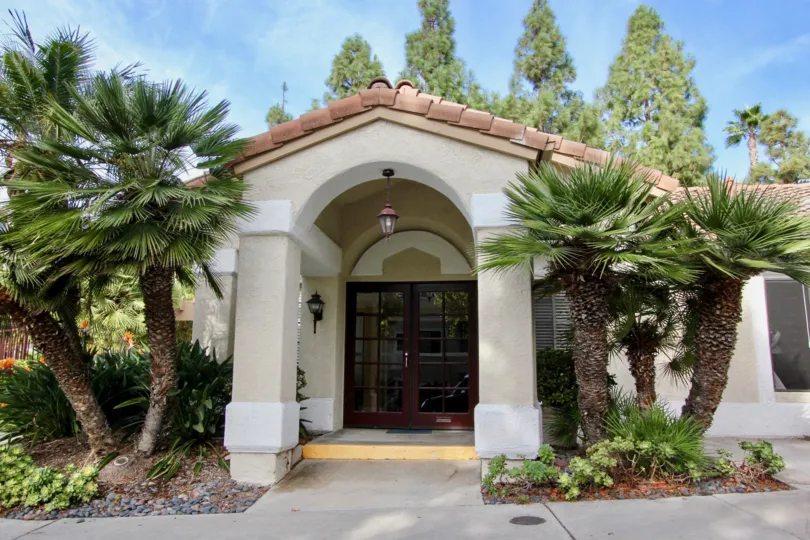 Palm tree flanked entryway to home in the Vista Way Village community in Oceanside, CA