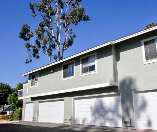 In the Whelan Ranch are of Oceanside, California a for rent sign is on a window.