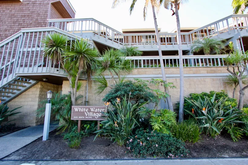 Terraces with iron railings and landscaping in the White Water Village community in Oceanside, CA