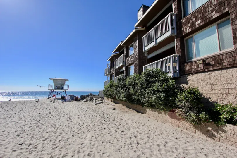 THE SEASHORE HOUSE IN THE WHITE WATER VILLAGE WITH SEA, PLANTS, SAND.