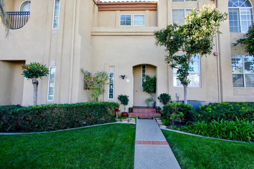 THE APARTMENT IN THE WIND & SEA TOWNHOMES WITH THE GRASSLANDS, FLOWER WASH, TREES, PLANTS.
