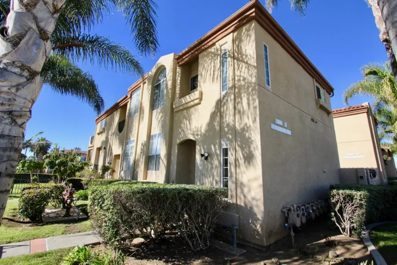 Townhomes surrounded by palm trees in Oceanside, California.
