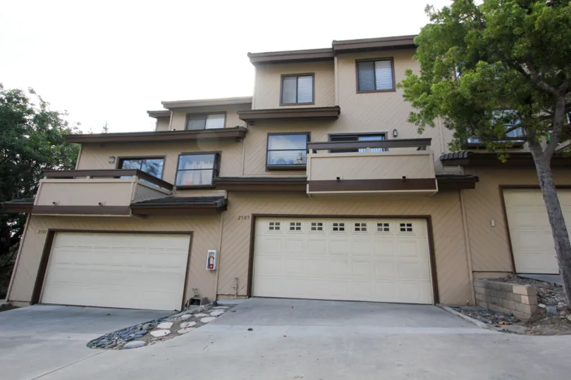 Wide garage doors sit on two car garages at the Woodland Ivy.
