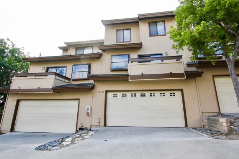 Three story modern home with three separate garages, located at Woodlands Ivy, in Oceanside, California.