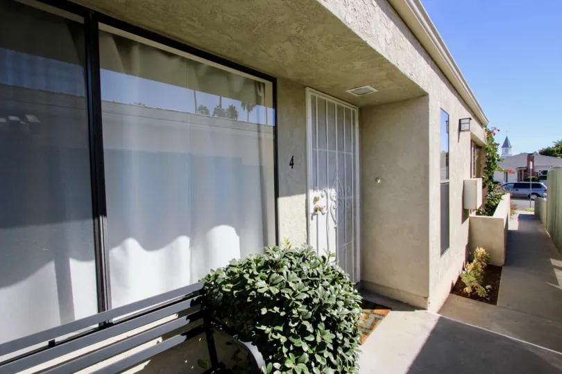 A sunny day in the area of 1076 Opal, outside, sidewalk, car, door, window, curtain